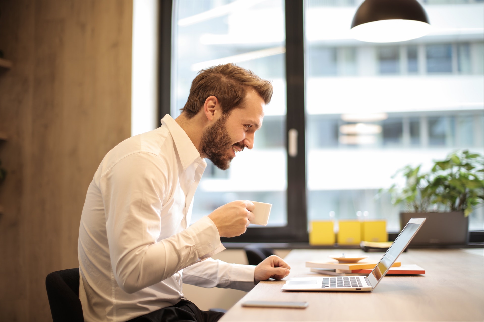 http://www.a1vending.biz/wp-content/uploads/2020/04/man-holding-teacup-infront-of-laptop-on-top-of-table-inside-925786.jpg